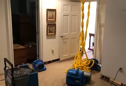 Water damage restoration equipment drying a Metairie, LA home