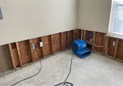 Lower drywall opened for structural drying in a Metairie house