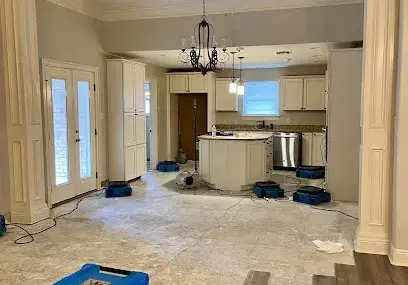 Drying equipment set up in a water-damaged Metairie living space